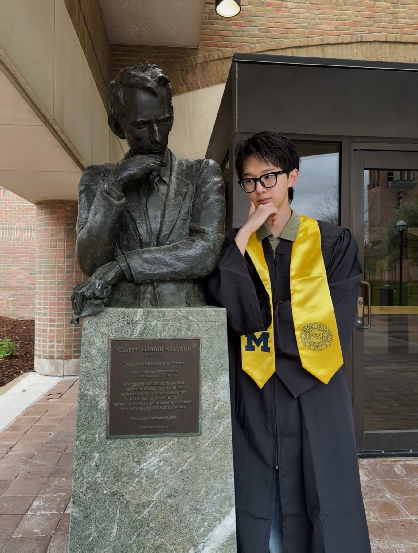 Claude Shannon statue and Linglong Meng outside the EECS Building
